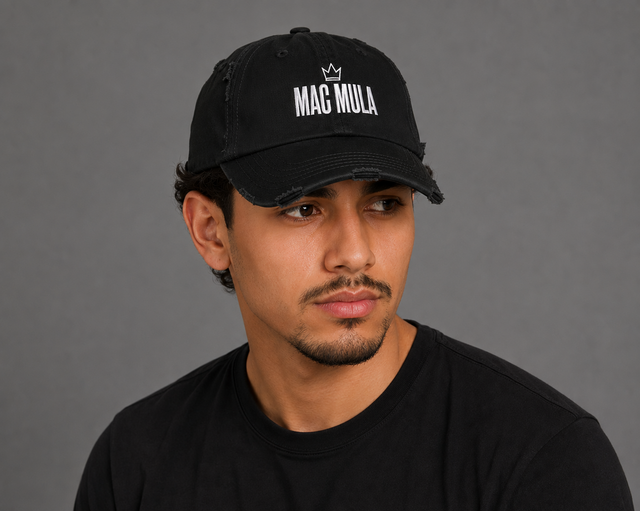 Model wearing the MAC MULA Distressed Dad Hat in black, three-quarter view