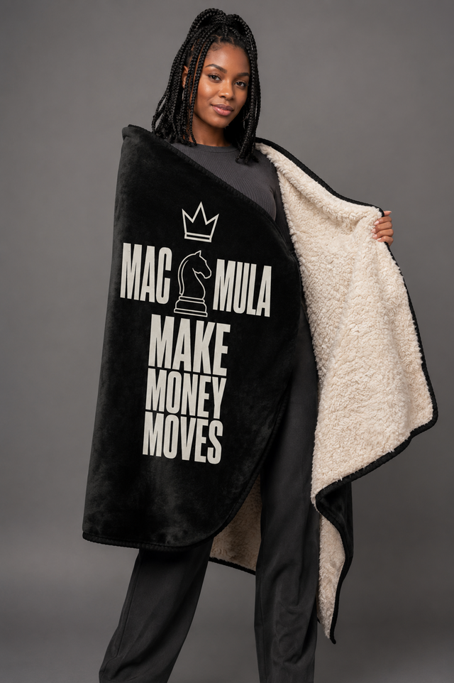 Woman wrapped in the MAC MULA Make Money Moves Sherpa Blanket, showing the sherpa reverse