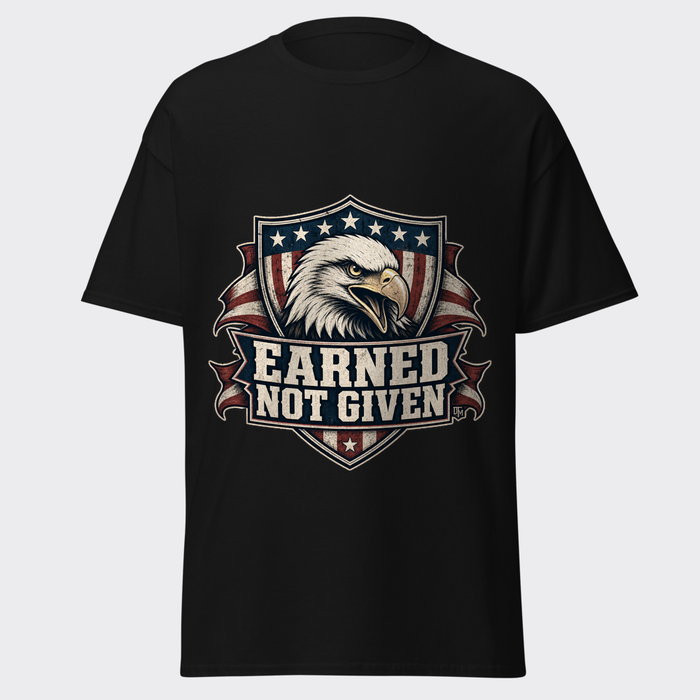 EARNED NOT GIVEN stamped beneath a fierce bald eagle over a distressed American flag shield on a black tee