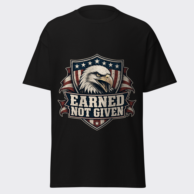 EARNED NOT GIVEN stamped beneath a fierce bald eagle over a distressed American flag shield on a black tee