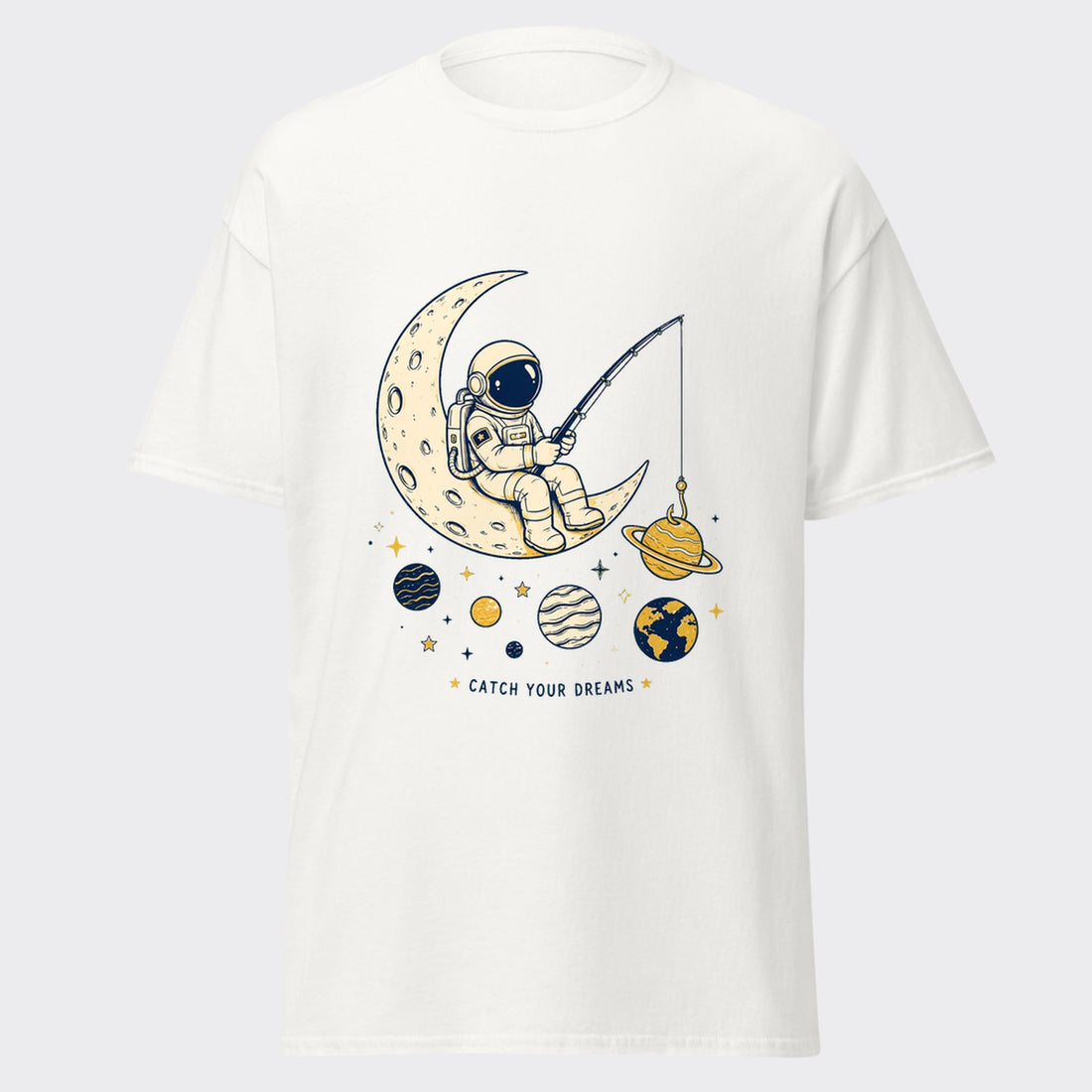 CATCH YOUR DREAMS astronaut fishing on a crescent moon among planets graphic on a white tee